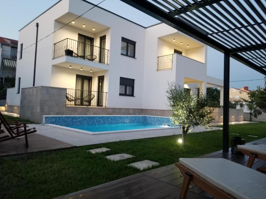 Villa Sobin with its private pool and garden at dusk